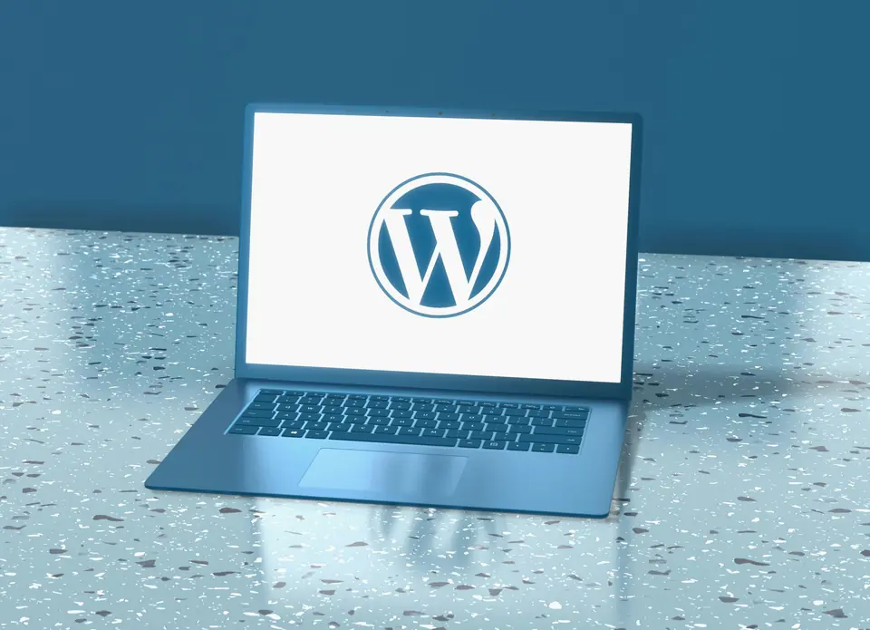 Laptop showing the WordPress logo, for WordPress maintenance and website security
